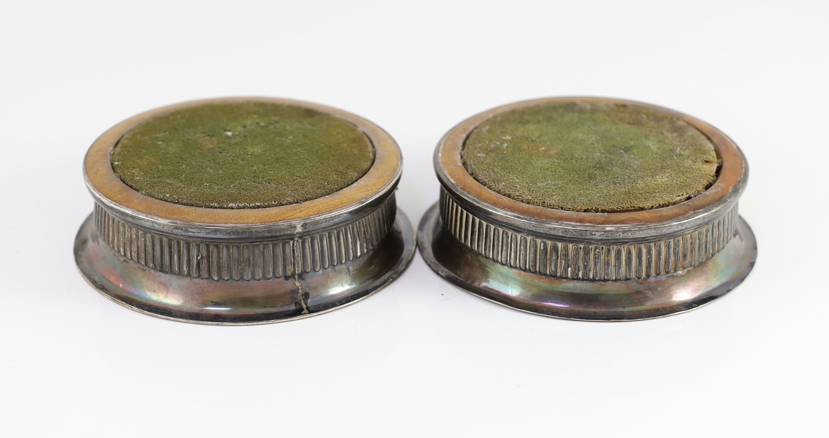 A matched pair of George III silver mounted wine coasters, one by John Love & Co, Sheffield circa 1790, the other by John Roberts & Co, Sheffield, 1807